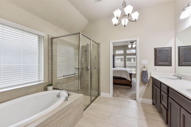 ensuite bathroom with a sink, a shower stall, a bath, double vanity, and ensuite bath