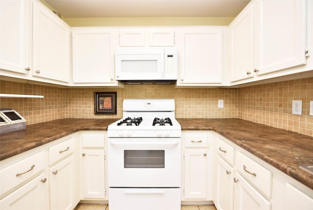 kitchen with white cabinets, white appliances, and decorative backsplash