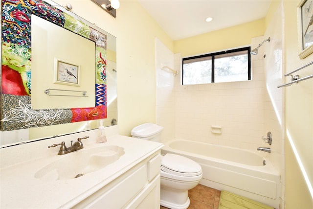 bathroom featuring  shower combination, vanity, toilet, and tile patterned floors