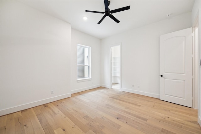 unfurnished room featuring light wood-type flooring, baseboards, a ceiling fan, and recessed lighting