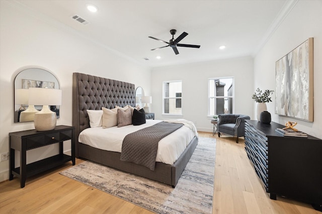 bedroom featuring recessed lighting, visible vents, ornamental molding, ceiling fan, and light wood-type flooring