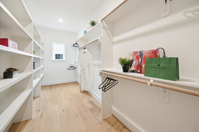 walk in closet featuring light wood-style floors