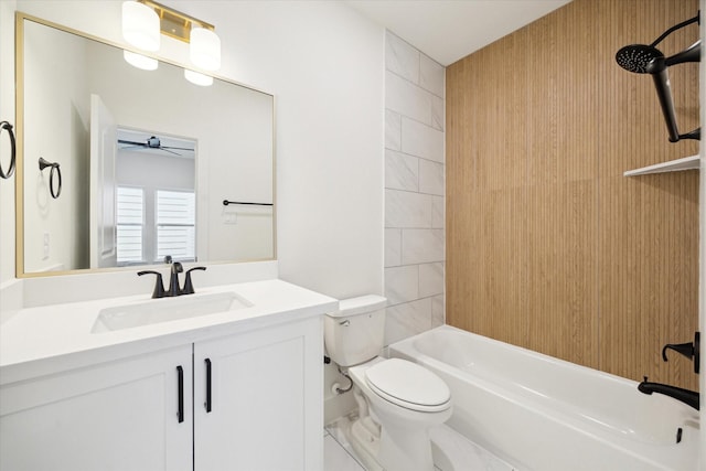 full bathroom featuring ceiling fan, shower / bathing tub combination, vanity, and toilet