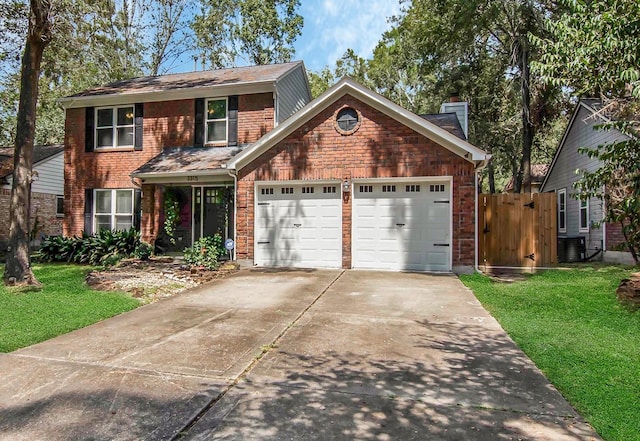 view of front of home featuring an attached garage, brick siding, concrete driveway, a chimney, and a front yard