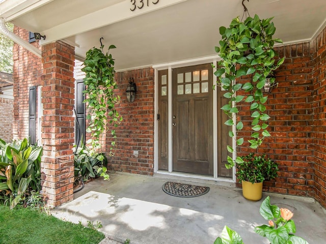 entrance to property with brick siding