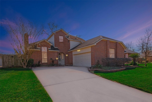 traditional home with brick siding, a lawn, driveway, and an attached garage