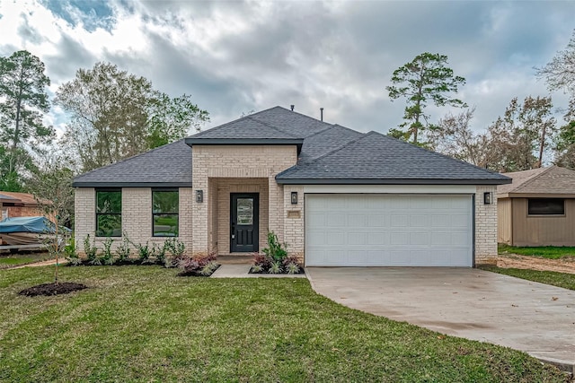 view of front of house with a garage, a front yard, concrete driveway, and brick siding