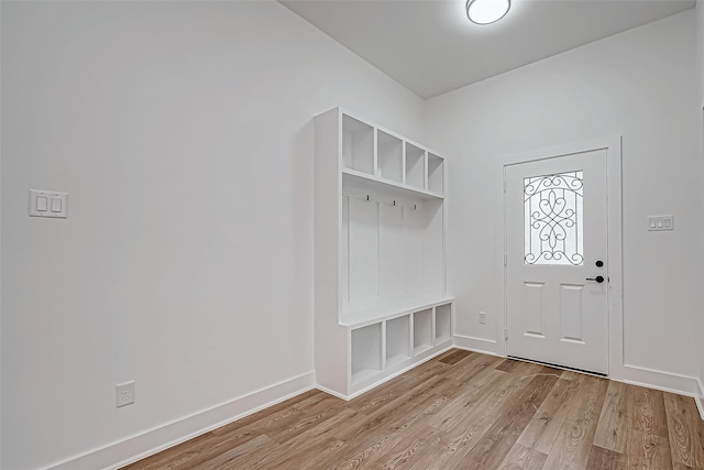 mudroom with baseboards and wood finished floors