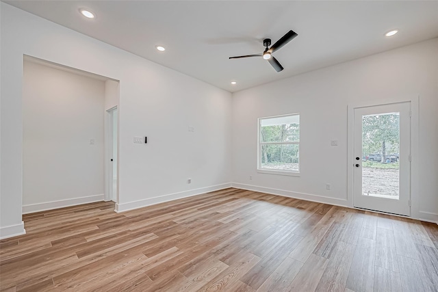 empty room with light wood finished floors, ceiling fan, baseboards, and recessed lighting