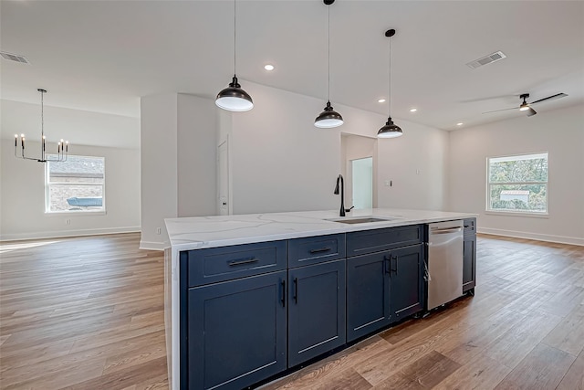 kitchen with open floor plan, a sink, and visible vents