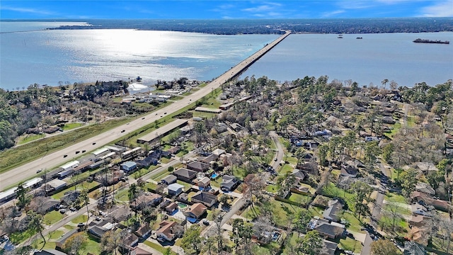 bird's eye view featuring a water view and a residential view