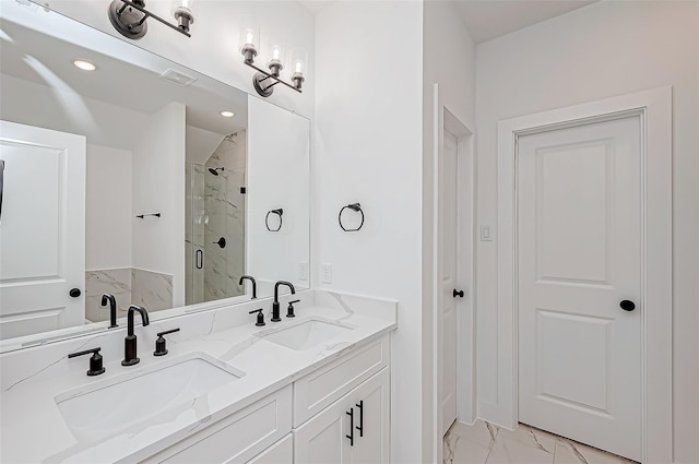 bathroom featuring a stall shower, marble finish floor, visible vents, and a sink