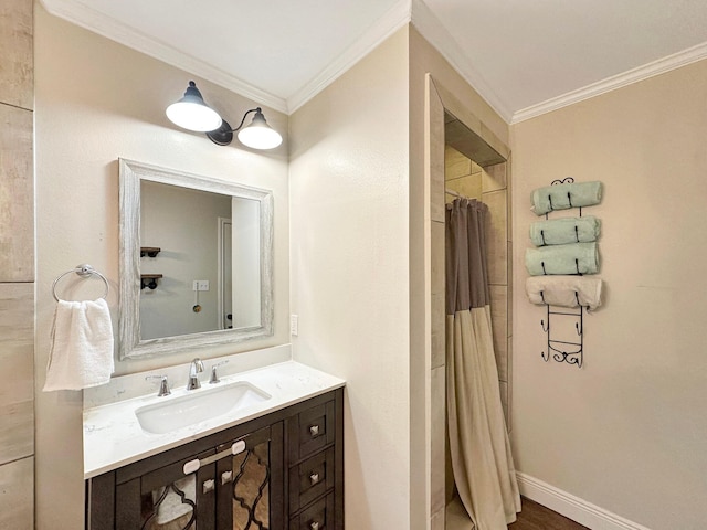 bathroom featuring baseboards, curtained shower, vanity, and crown molding