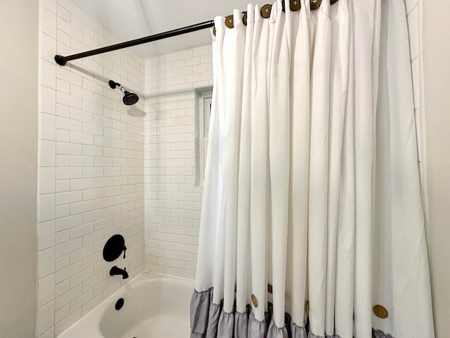 bathroom with shower / tub combo with curtain