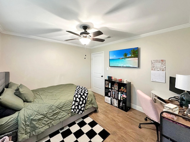 bedroom with a ceiling fan, visible vents, ornamental molding, and wood finished floors