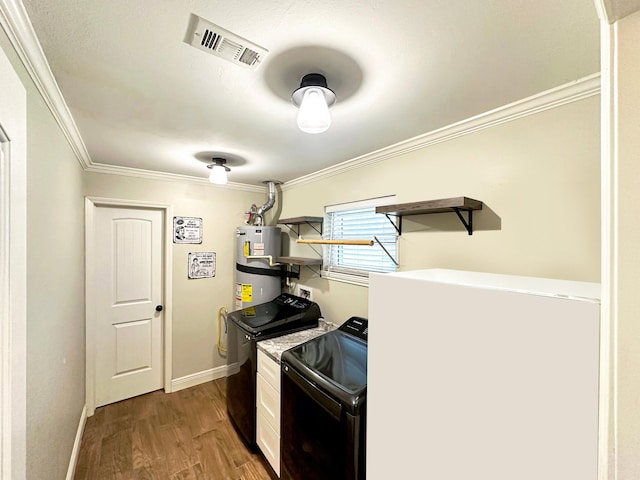 kitchen with visible vents, strapped water heater, ornamental molding, washing machine and clothes dryer, and open shelves