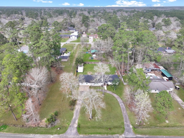 drone / aerial view featuring a view of trees