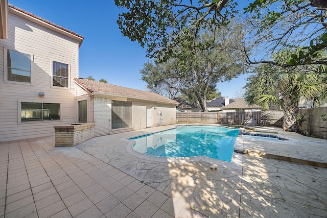 view of swimming pool with a patio area, a fenced backyard, and a fenced in pool