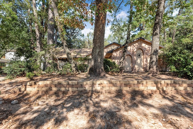 view of front of home featuring brick siding