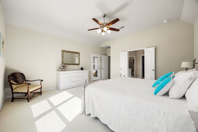 bedroom featuring light colored carpet, visible vents, vaulted ceiling, and baseboards