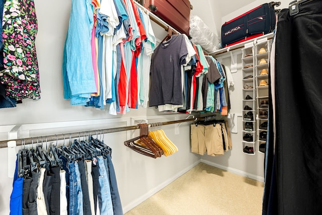 spacious closet with carpet flooring