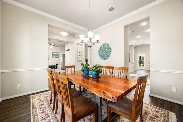 dining area with dark wood-style floors, visible vents, baseboards, and crown molding