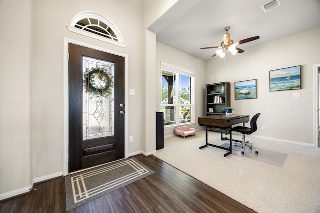 entrance foyer featuring ceiling fan, wood finished floors, visible vents, and baseboards