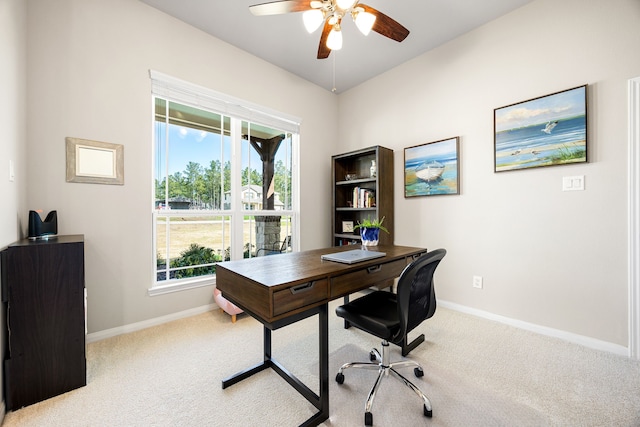 office area featuring carpet, a ceiling fan, and baseboards