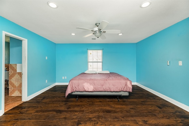 unfurnished bedroom featuring recessed lighting, wood finished floors, and baseboards