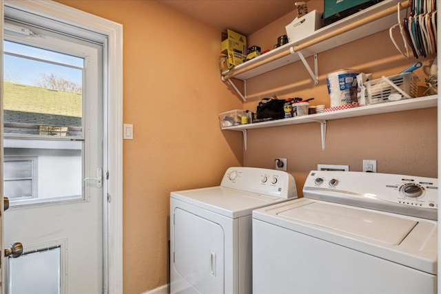 laundry room featuring washing machine and dryer and laundry area