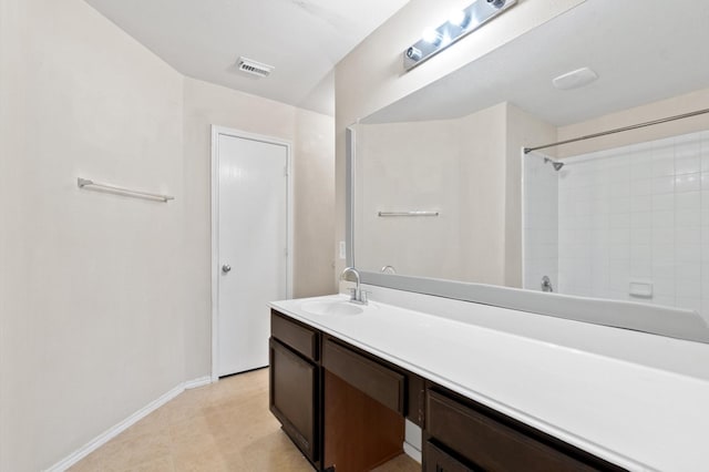 full bath with a shower, vanity, visible vents, and baseboards