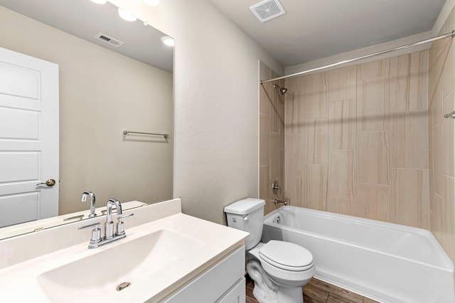 full bathroom with toilet, visible vents,  shower combination, and vanity