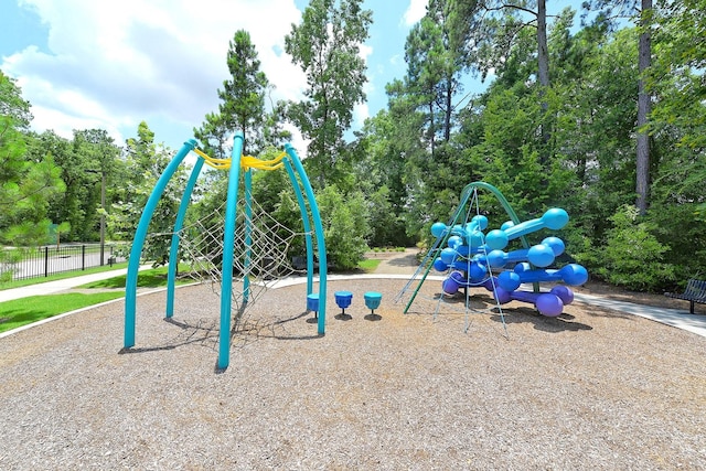 communal playground featuring fence