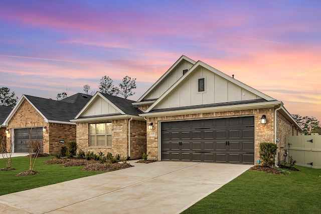 view of front of house with brick siding, concrete driveway, board and batten siding, a front yard, and a garage