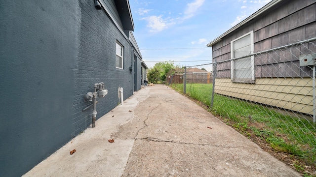 view of home's exterior featuring fence