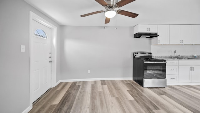 kitchen featuring light wood-style flooring, white cabinetry, stainless steel range with electric stovetop, and under cabinet range hood