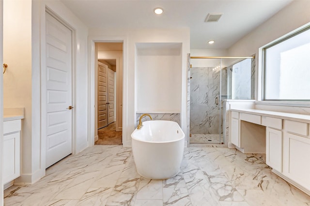 bathroom featuring a marble finish shower, visible vents, a soaking tub, marble finish floor, and vanity