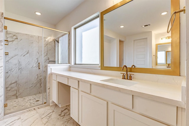 full bath featuring a marble finish shower, visible vents, marble finish floor, vanity, and recessed lighting