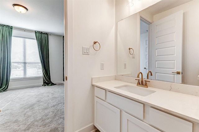 bathroom featuring vanity and baseboards