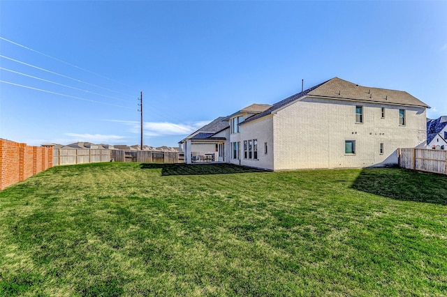 view of yard featuring a fenced backyard