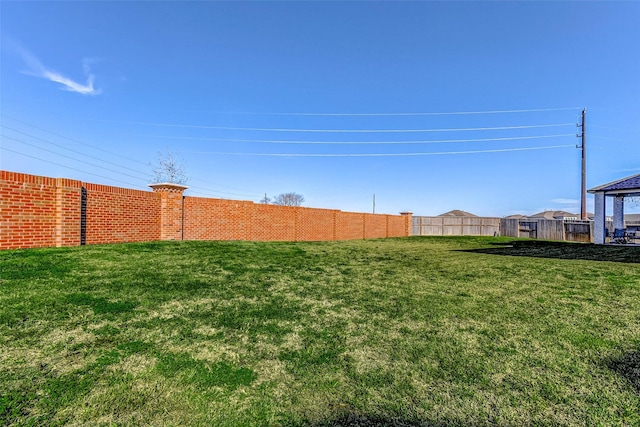 view of yard with fence