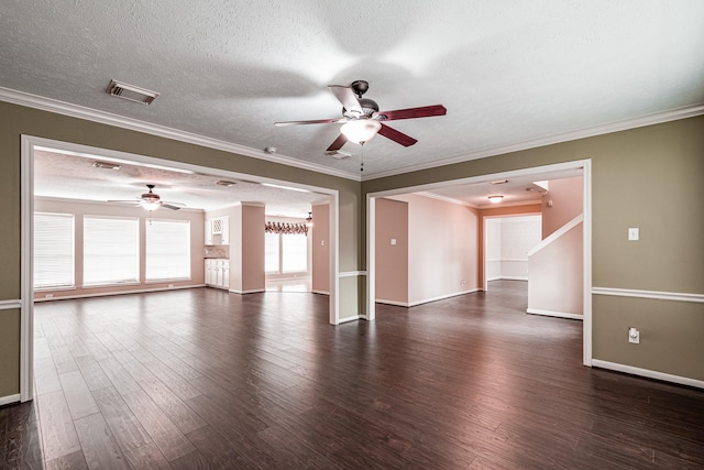 unfurnished living room featuring visible vents, dark wood-style floors, ceiling fan, ornamental molding, and a textured ceiling