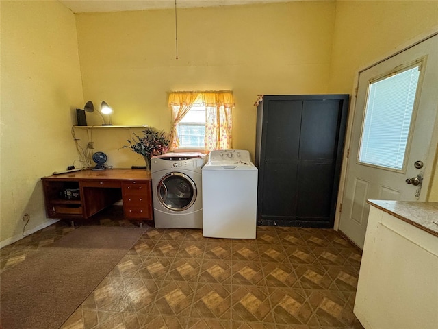 laundry area with laundry area and separate washer and dryer