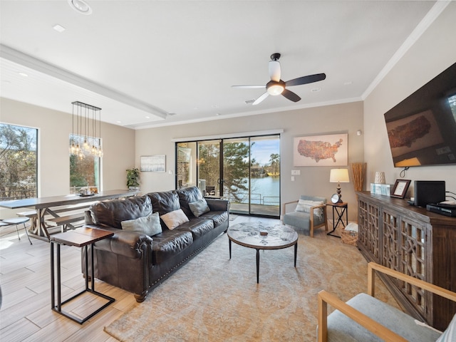 living area with light wood-style floors, crown molding, and ceiling fan with notable chandelier