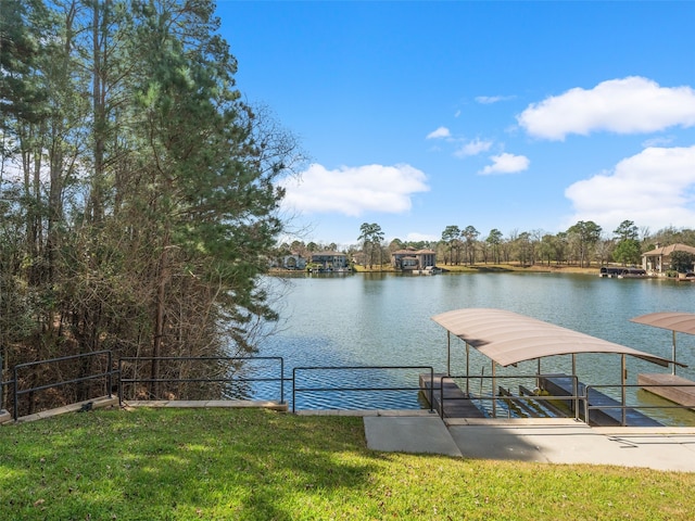 dock area featuring a yard and a water view