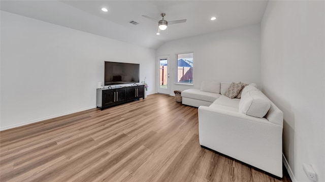 living area with visible vents, a ceiling fan, light wood-style flooring, vaulted ceiling, and recessed lighting