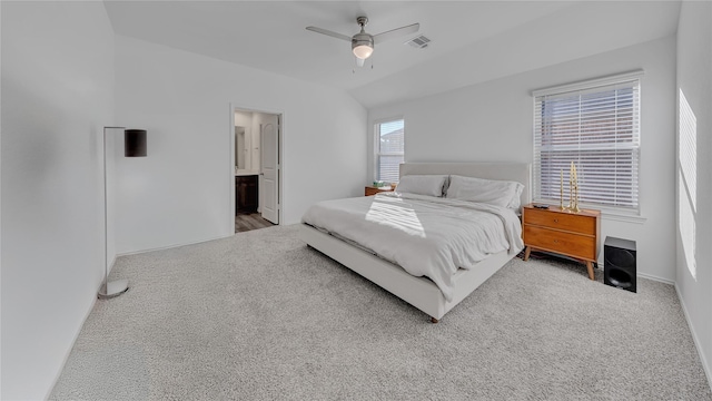 bedroom with lofted ceiling, baseboards, visible vents, and carpet flooring