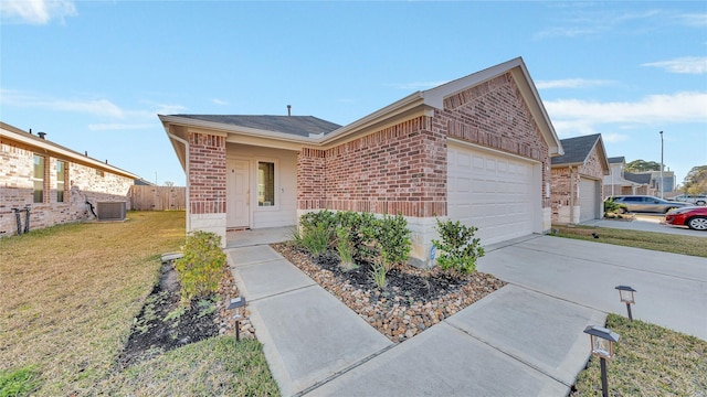 ranch-style house featuring a garage, driveway, fence, a front lawn, and brick siding