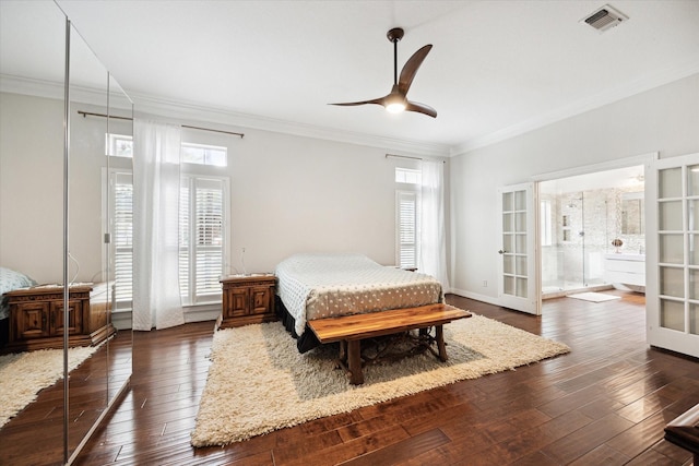 bedroom with multiple windows, visible vents, dark wood-type flooring, and french doors