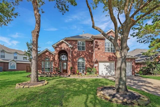 traditional home featuring brick siding, concrete driveway, roof with shingles, an attached garage, and a front yard